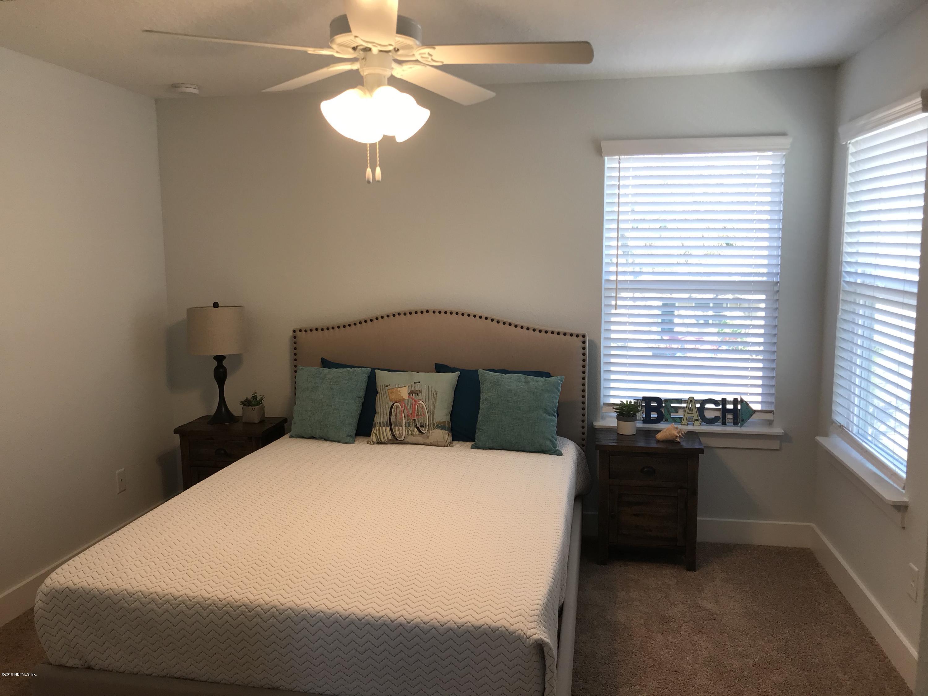 1709 Riley Street Jacksonville Beach, FL 32250 - Photo 38 of 42 a bedroom with a bed and a window