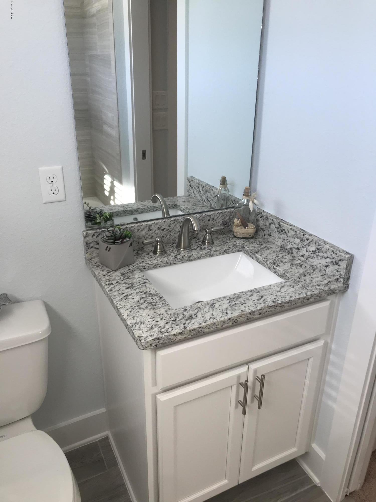 1709 Riley Street Jacksonville Beach, FL 32250 - Photo 40 of 42 a bathroom with a granite countertop sink and a toilet