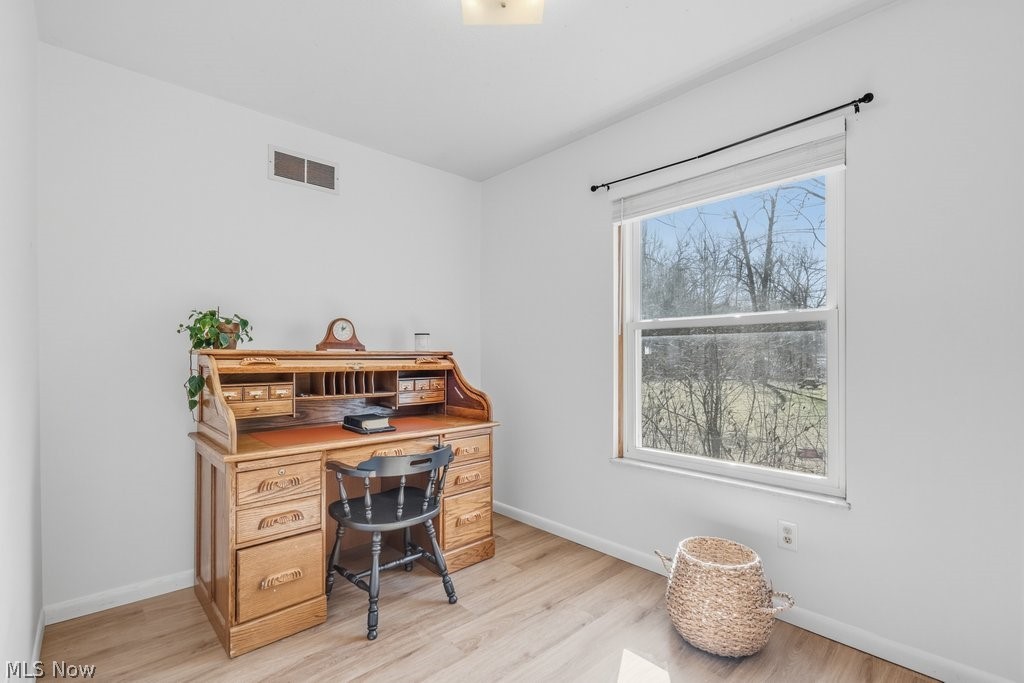 151 Meadowridge Road Mogadore, OH 44260 - Photo 15 of 26 Home office featuring light wood-style floors and baseboards