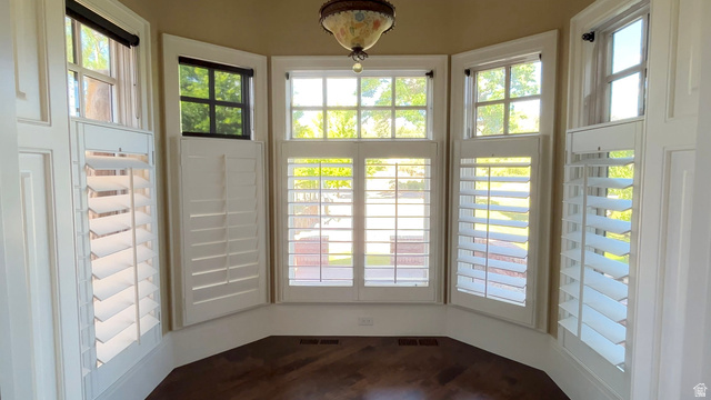426 West Center Street Parowan, UT 84761 - Photo 25 of 107 Bay window with white plantation shutters, wood-finish flooring, and an ornate ceiling fixture