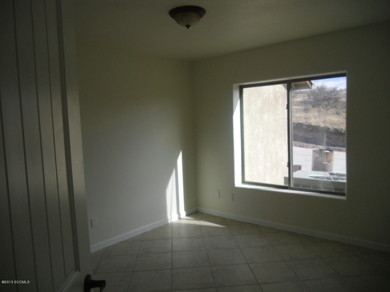 264 Paseo Mascota Rio Rico, AZ 85648 - Photo 16 of 39 a view of an empty room with a window