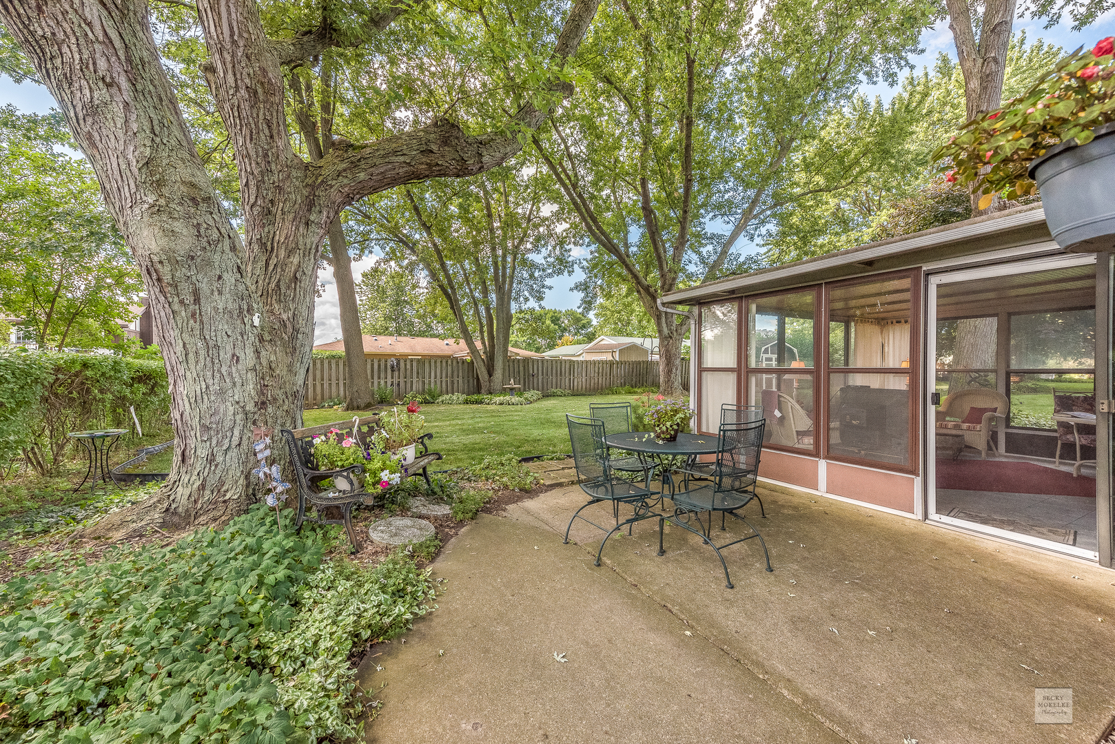 115 Neil Road Sugar Grove, IL 60554 - Photo 19 of 21 a view of a patio with table and chairs and floor to ceiling window