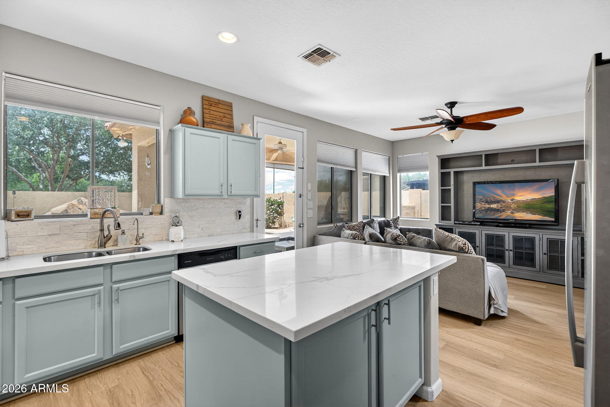 6280 South Sinova Court Gilbert, AZ 85298 - Photo 19 of 64 a kitchen with a stove a sink and a microwave