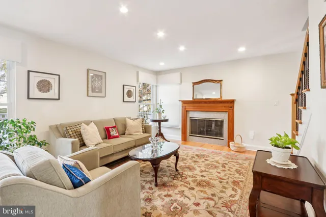a kitchen with kitchen island a counter top space a sink stainless steel appliances and cabinets