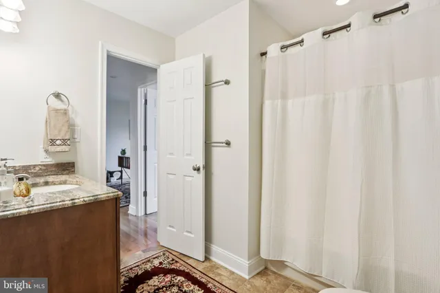a bedroom with furniture and a dresser