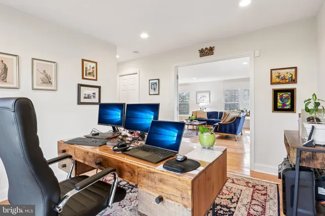 a bedroom with furniture and a wooden floor