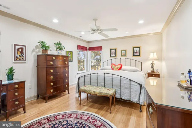 a bathroom with a tub a sink and a window
