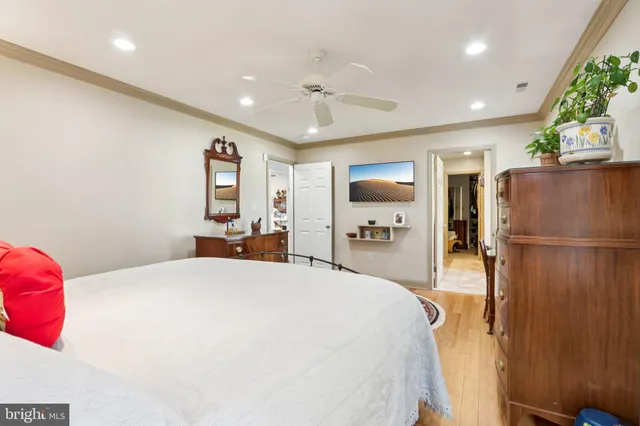 a bedroom with a bed and a dresser in it