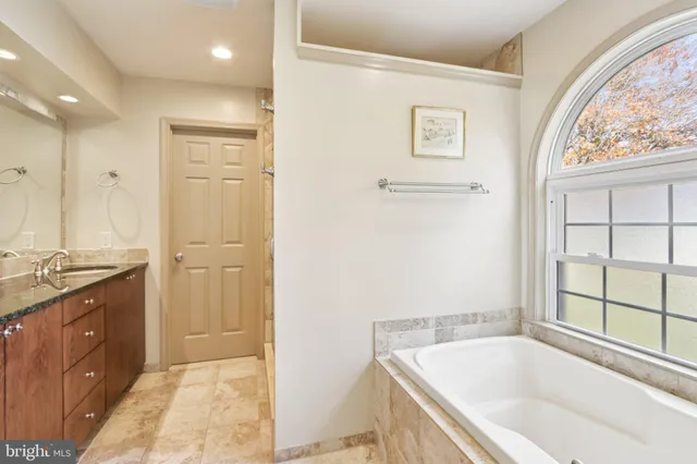 a bathroom with a sink a toilet and a bathtub