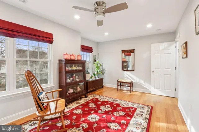 a view of a house with a big yard and large trees