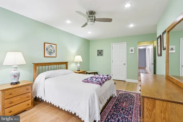an aerial view of a house with a yard and lake view