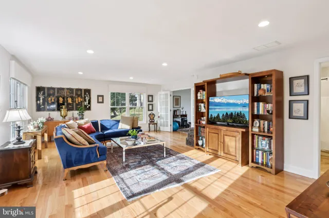 a living room with furniture and a table