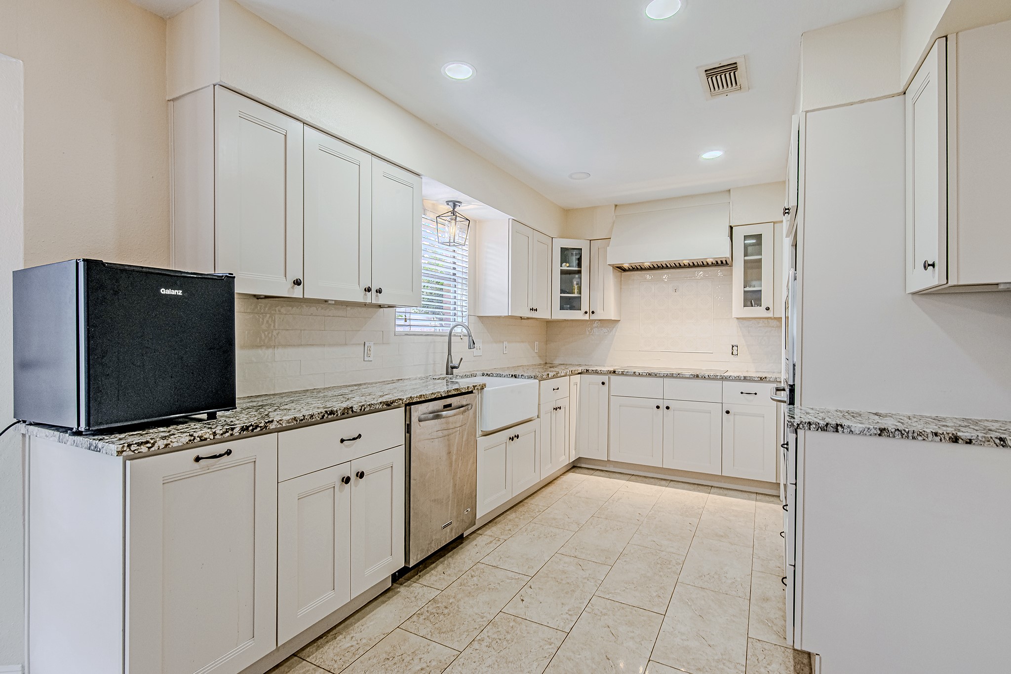 17811 Hawk Haven Lane Spring, TX 77379 - Photo 1 of 22 Updated kitchen with white cabinetry, ample counter space, and a functional layout.