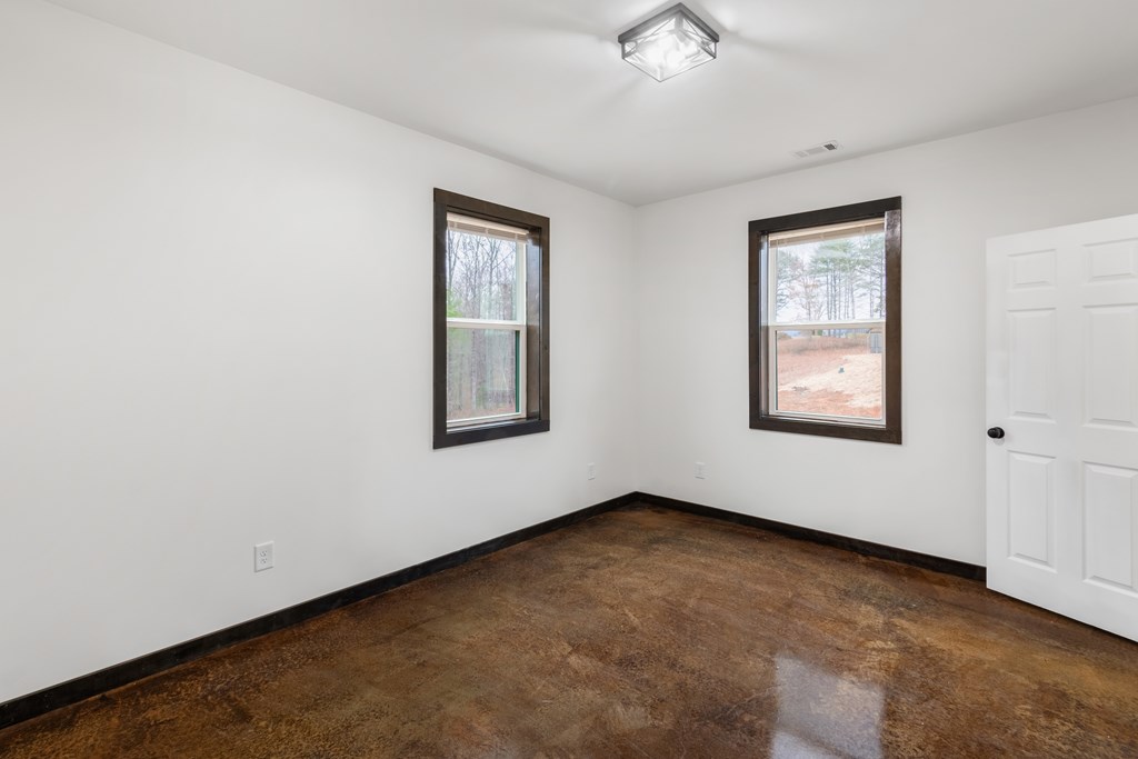 137 A Johnson Ford Road Epworth, GA 30541 - Photo 7 of 21 an empty room with windows