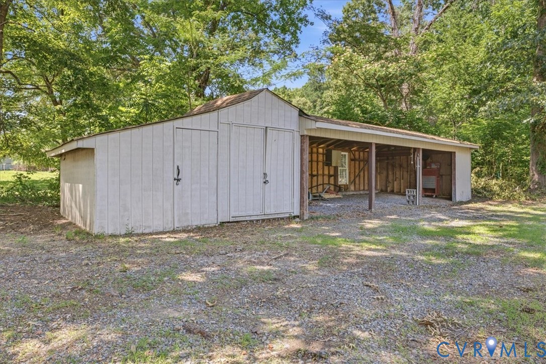 404 Bermuda Hundred Road Chester, VA 23836 - Photo 37 of 37 Outbuilding featuring a storage shed with double d