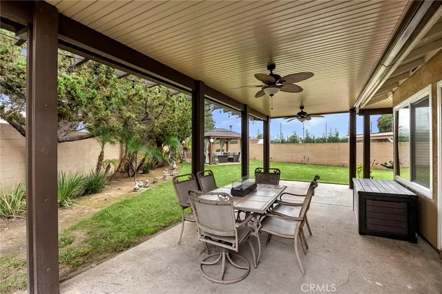 a patio with yard table and chairs