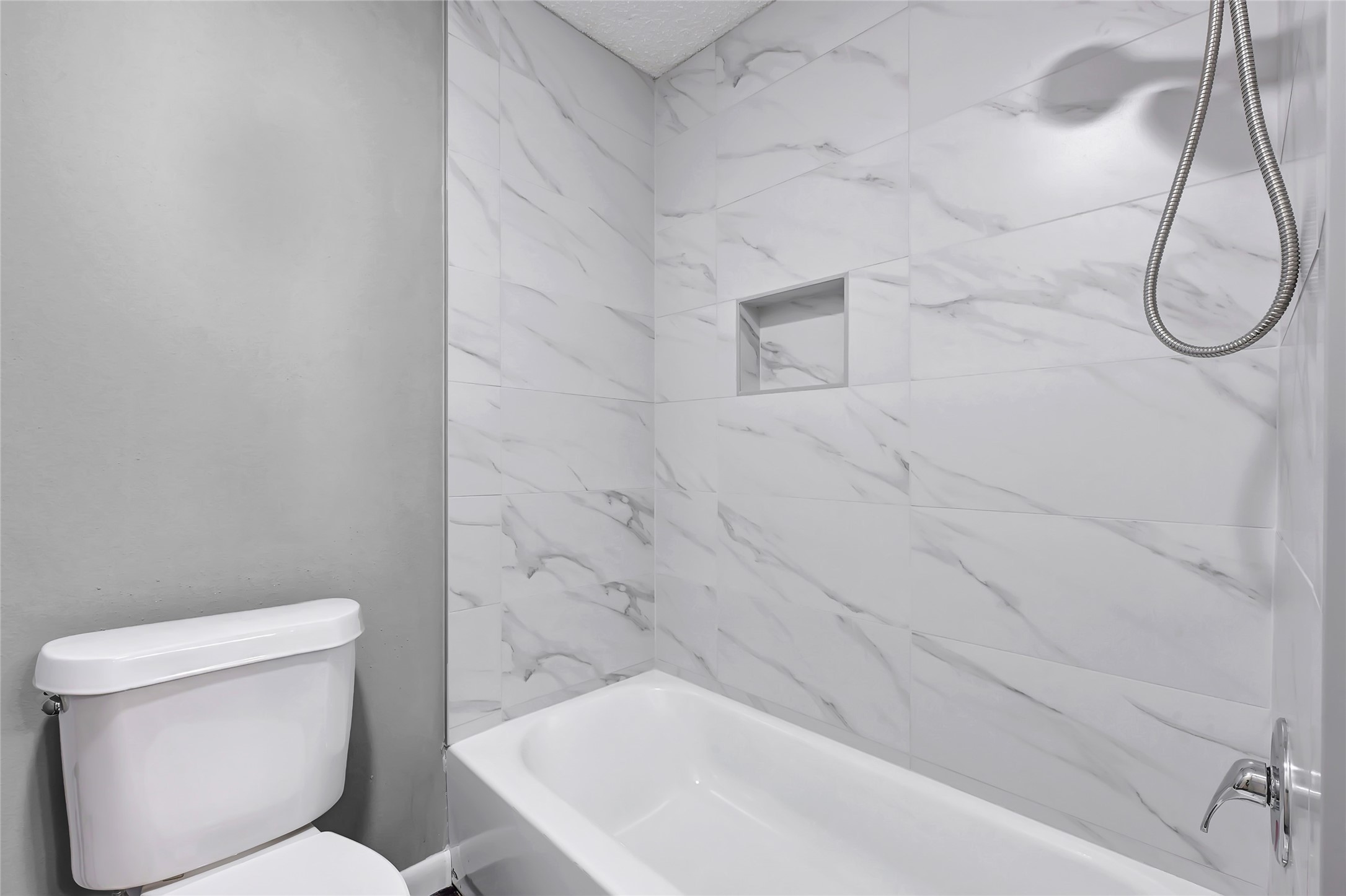 12111 Lemon Ridge Lane, Unit 121 Houston, TX 77035 - Photo 9 of 25 a bathroom with a toilet and a shower