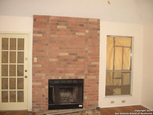 a stone house with a fireplace