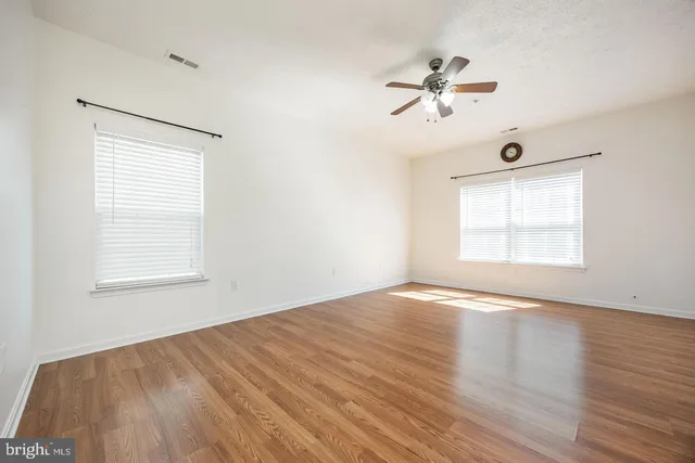 a bathroom with a double vanity sink and mirror