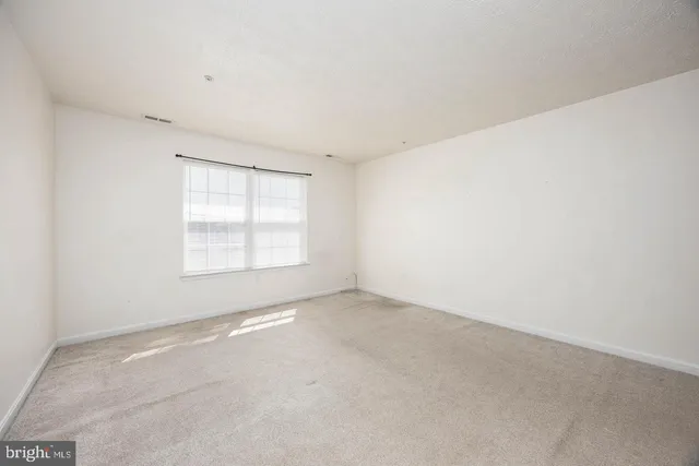 a backyard of a house with outdoor seating