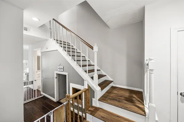 a living room with furniture wooden floor and a table