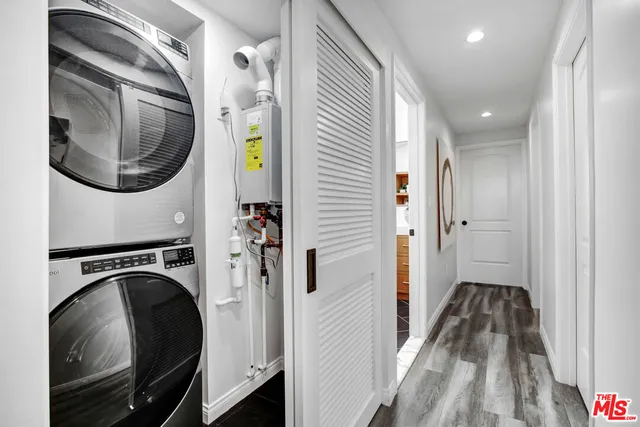 a view of a hallway with washer and dryer