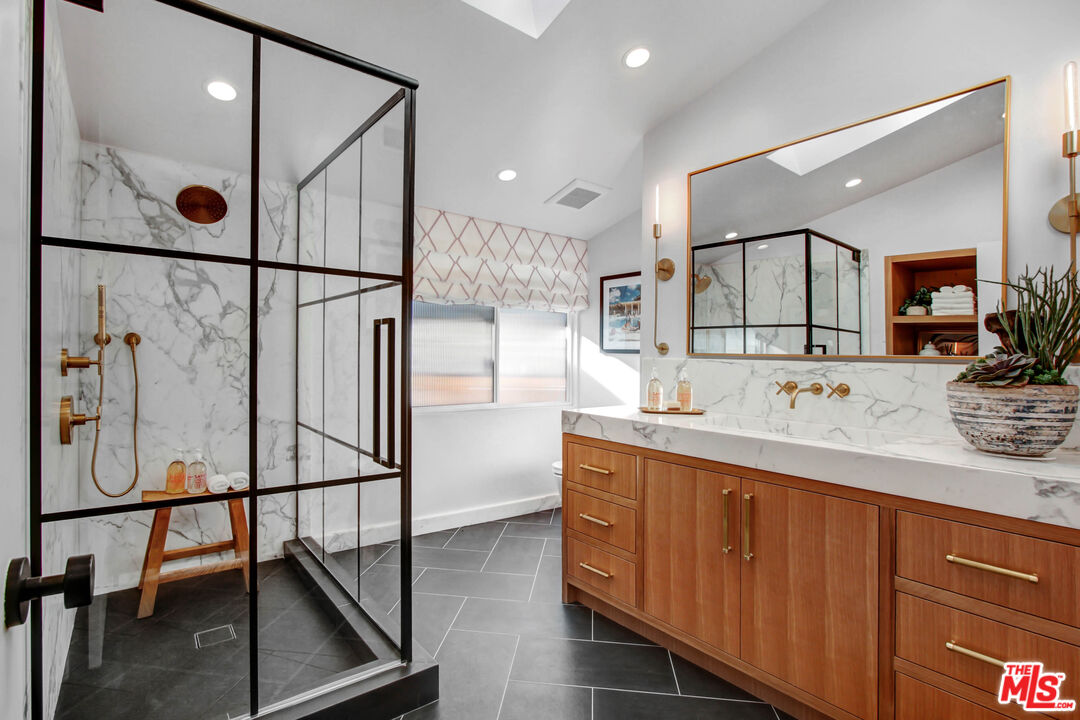 6440 Rhea Avenue Reseda, CA 91335 - Photo 14 of 22 a bathroom with a sink and mirror