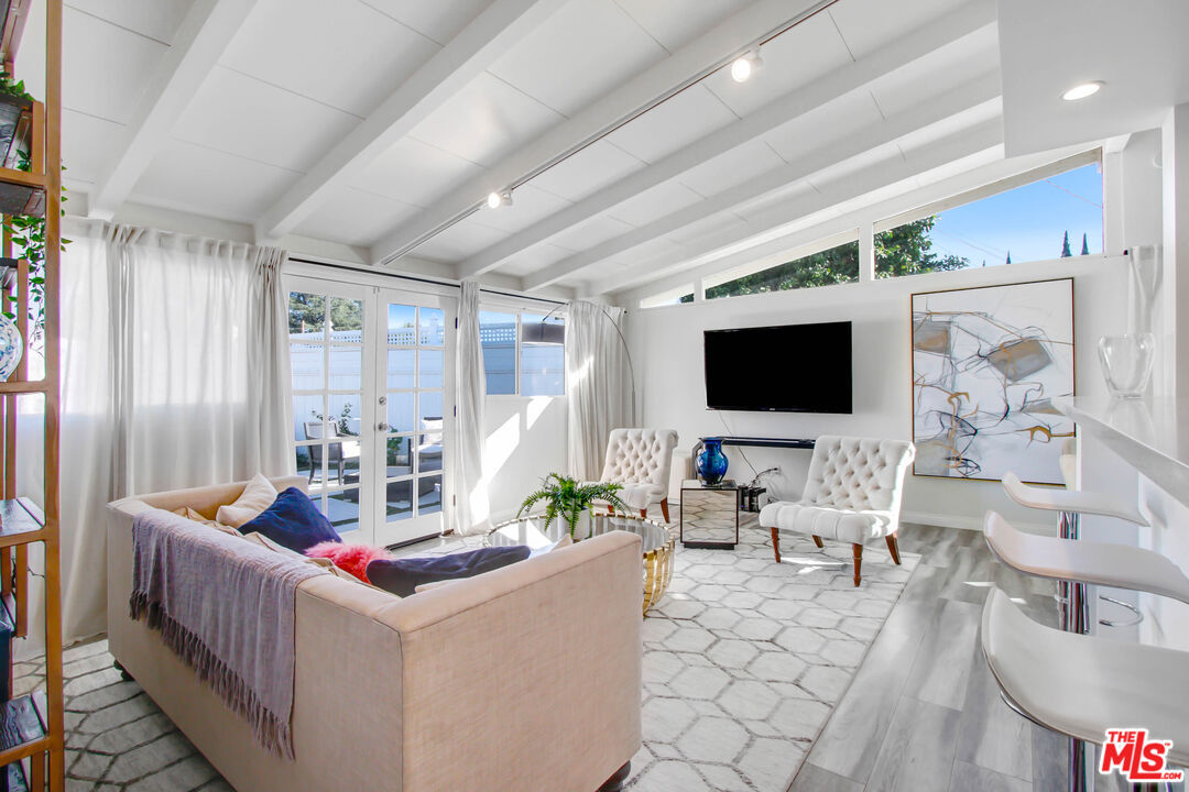 6440 Rhea Avenue Reseda, CA 91335 - Photo 17 of 22 a living room with furniture and a flat screen tv