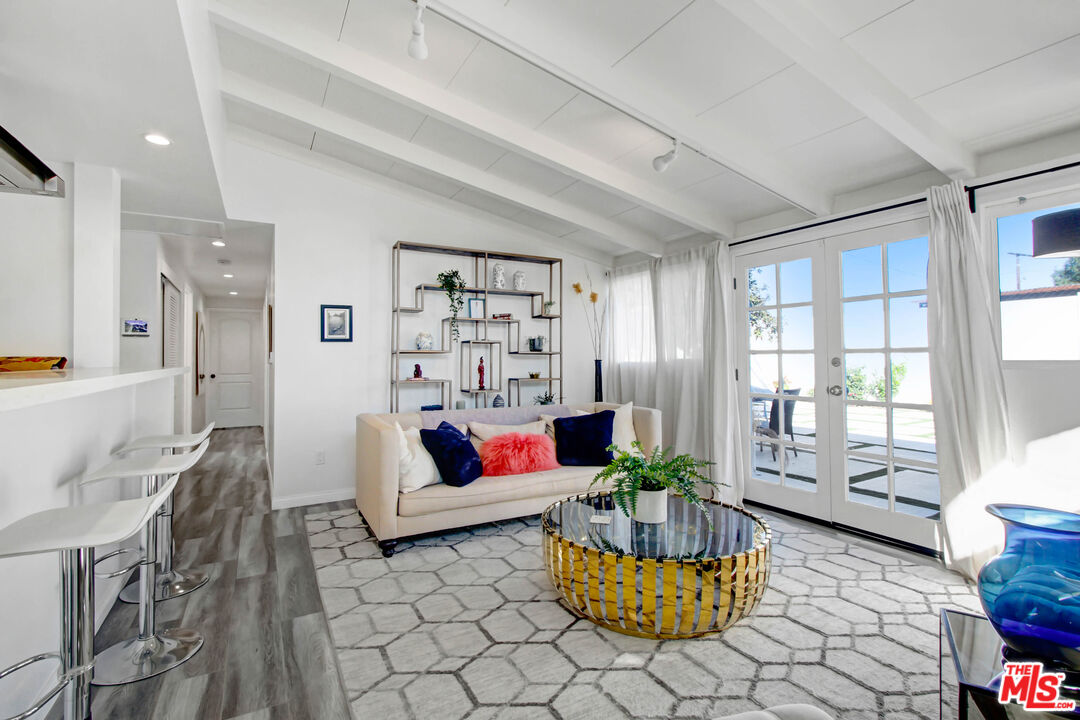 6440 Rhea Avenue Reseda, CA 91335 - Photo 18 of 22 a living room with furniture and wooden floor