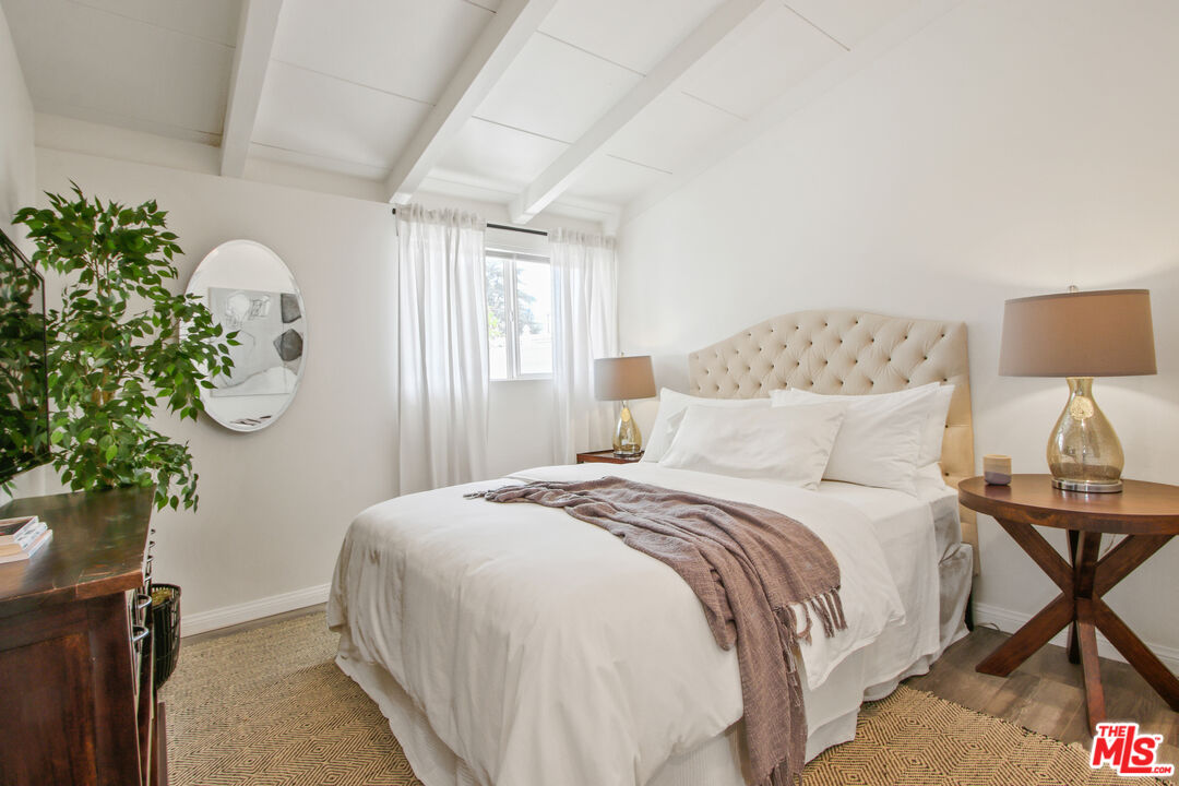 6440 Rhea Avenue Reseda, CA 91335 - Photo 20 of 22 a bedroom with a bed flowerpot and a window