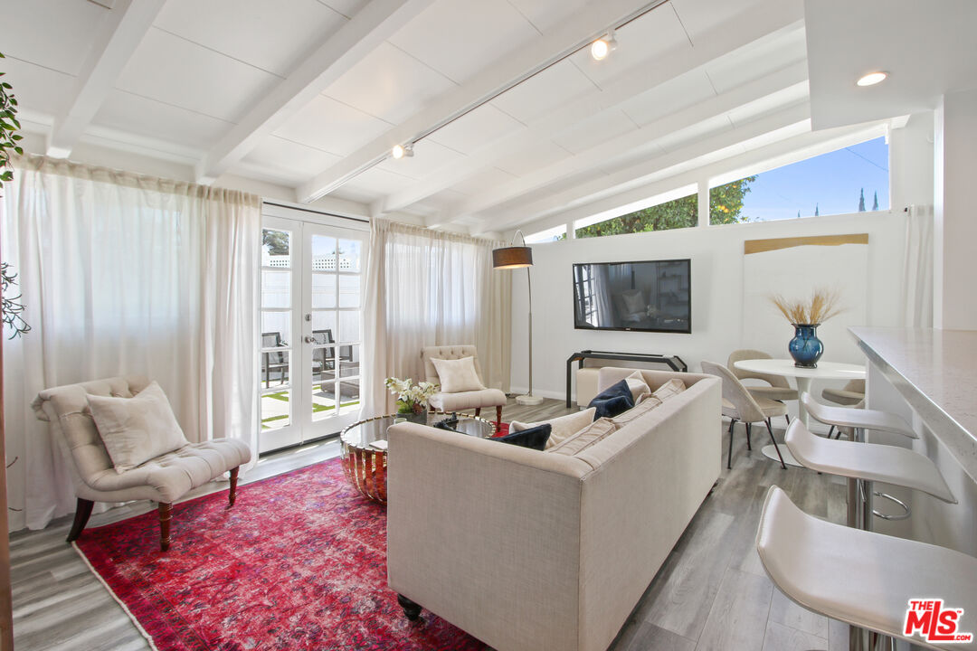 6440 Rhea Avenue Reseda, CA 91335 - Photo 4 of 22 a living room with furniture and a large window