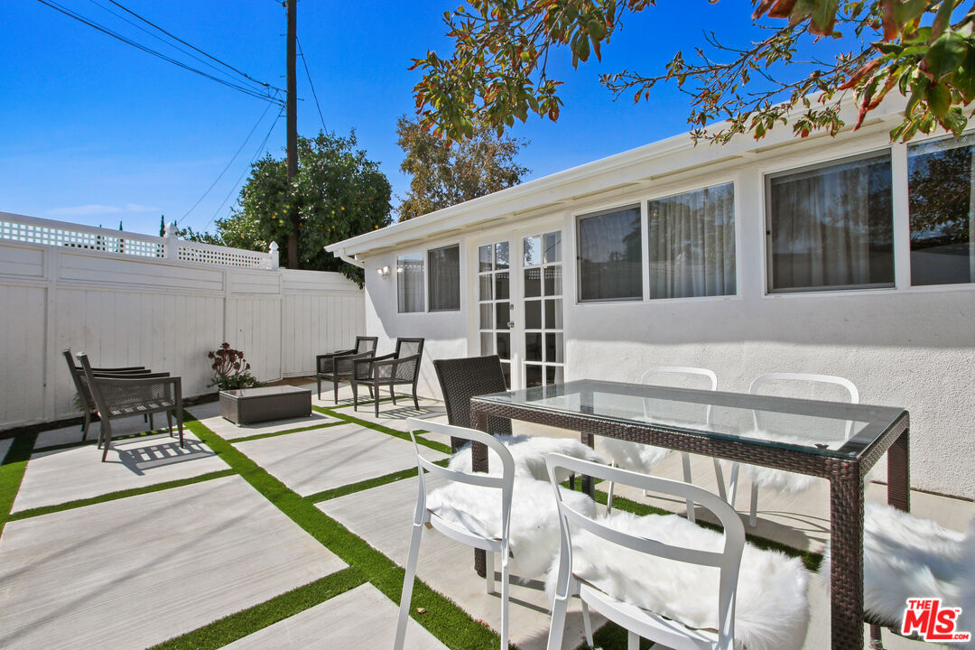 6440 Rhea Avenue Reseda, CA 91335 - Photo 8 of 22 a view of a patio with couches table and chairs and potted plants