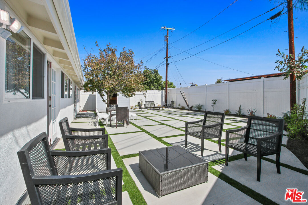 6440 Rhea Avenue Reseda, CA 91335 - Photo 9 of 22 a view of a dinning table and chairs in the patio