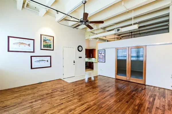 a view of a room with wooden floor