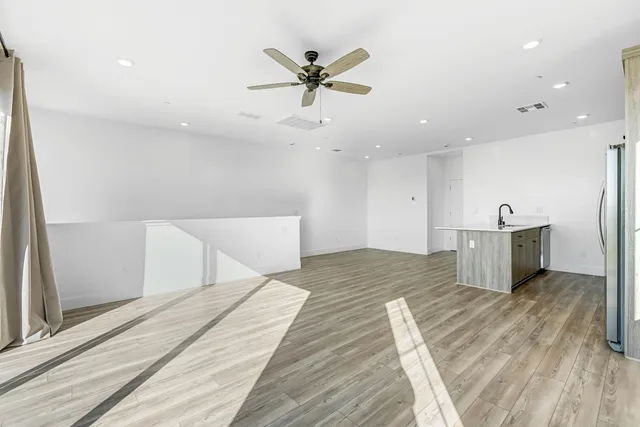 a very nice looking room with a ceiling fan