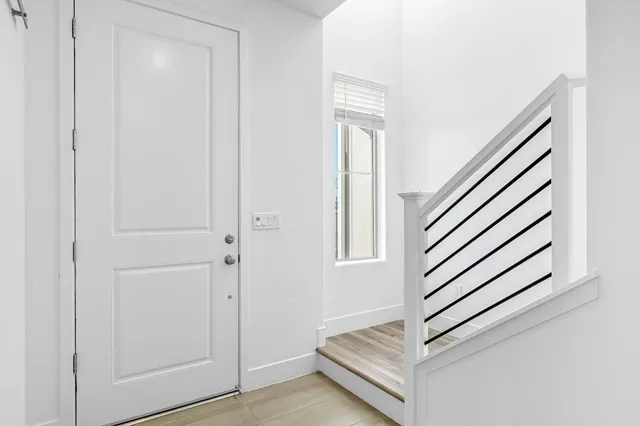 a view of a livingroom with stairs