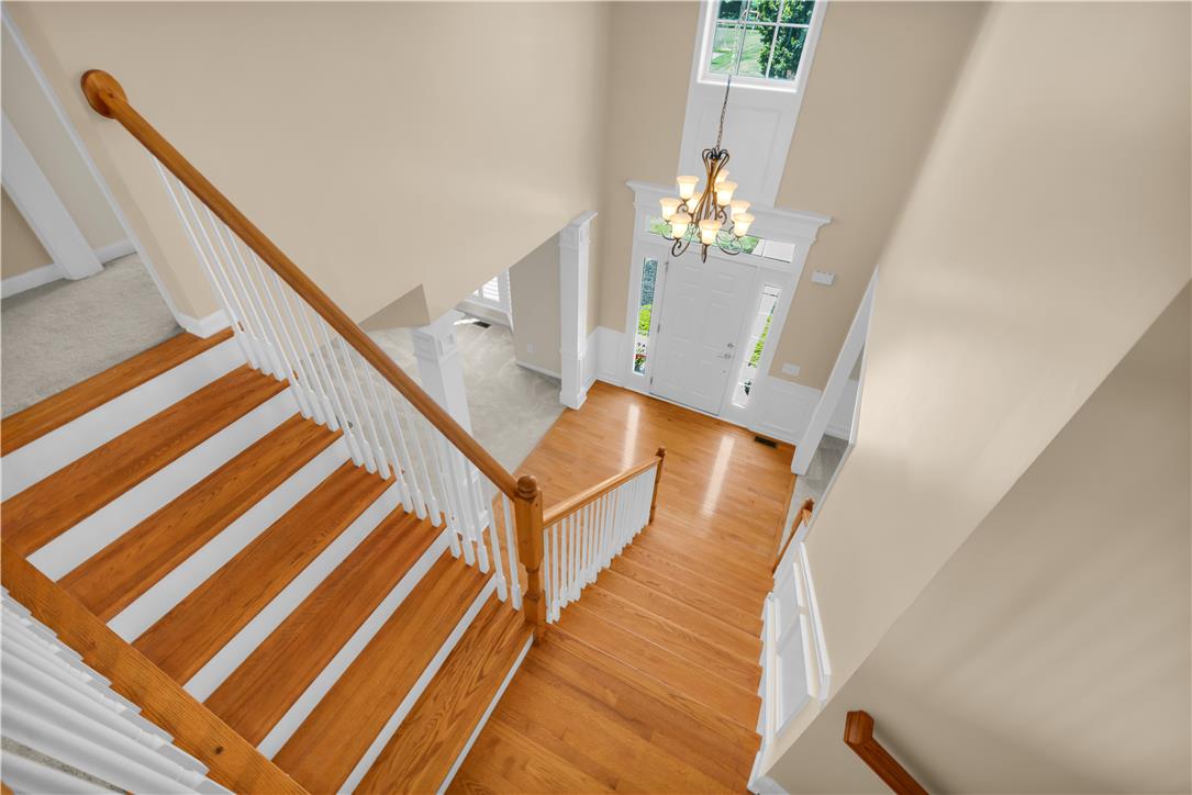 1709 Travers Road Breinigsville, PA 18031 - Photo 7 of 55 A grand entrance welcomes guests with polished hardwood flooring and a gracefully ascending staircase.