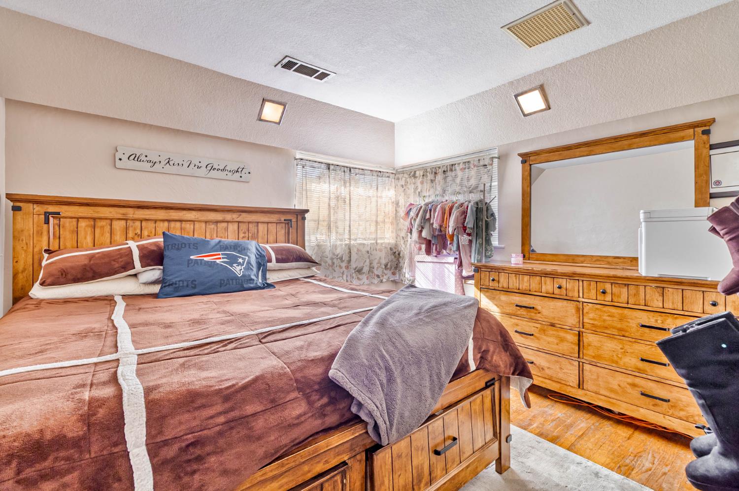 3852 East Washington Avenue Fresno, CA 93702 - Photo 15 of 30 a bedroom with a bed and window