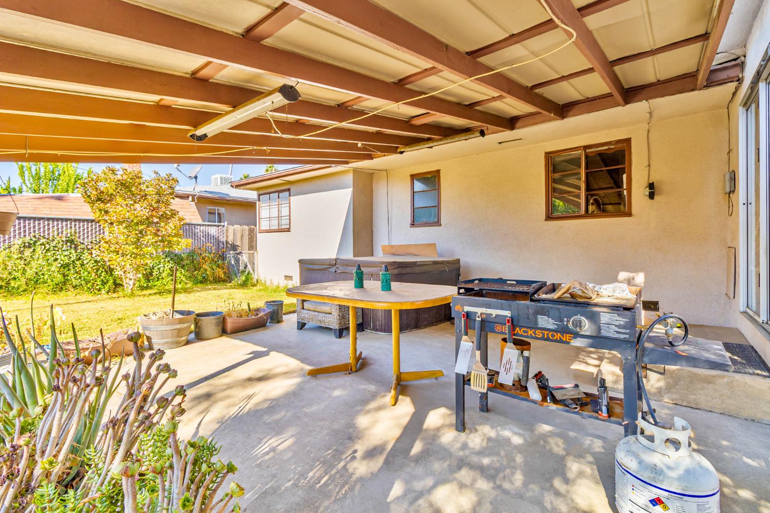3852 East Washington Avenue Fresno, CA 93702 - Photo 16 of 30 a living room with furniture and a table