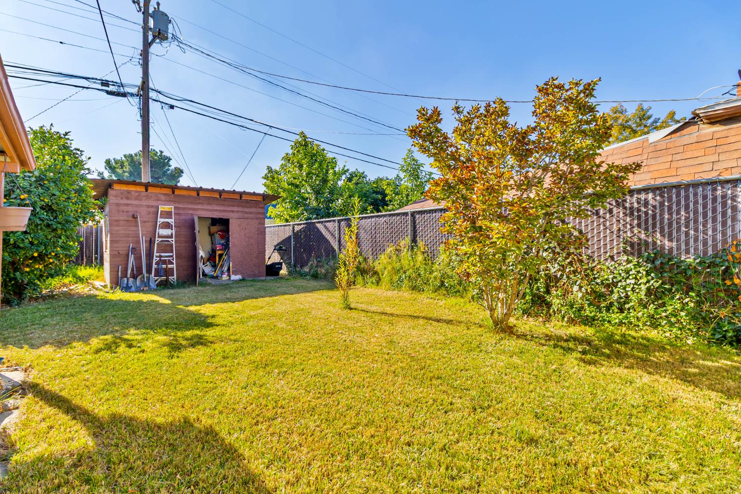 3852 East Washington Avenue Fresno, CA 93702 - Photo 19 of 30 a view of a house with a yard