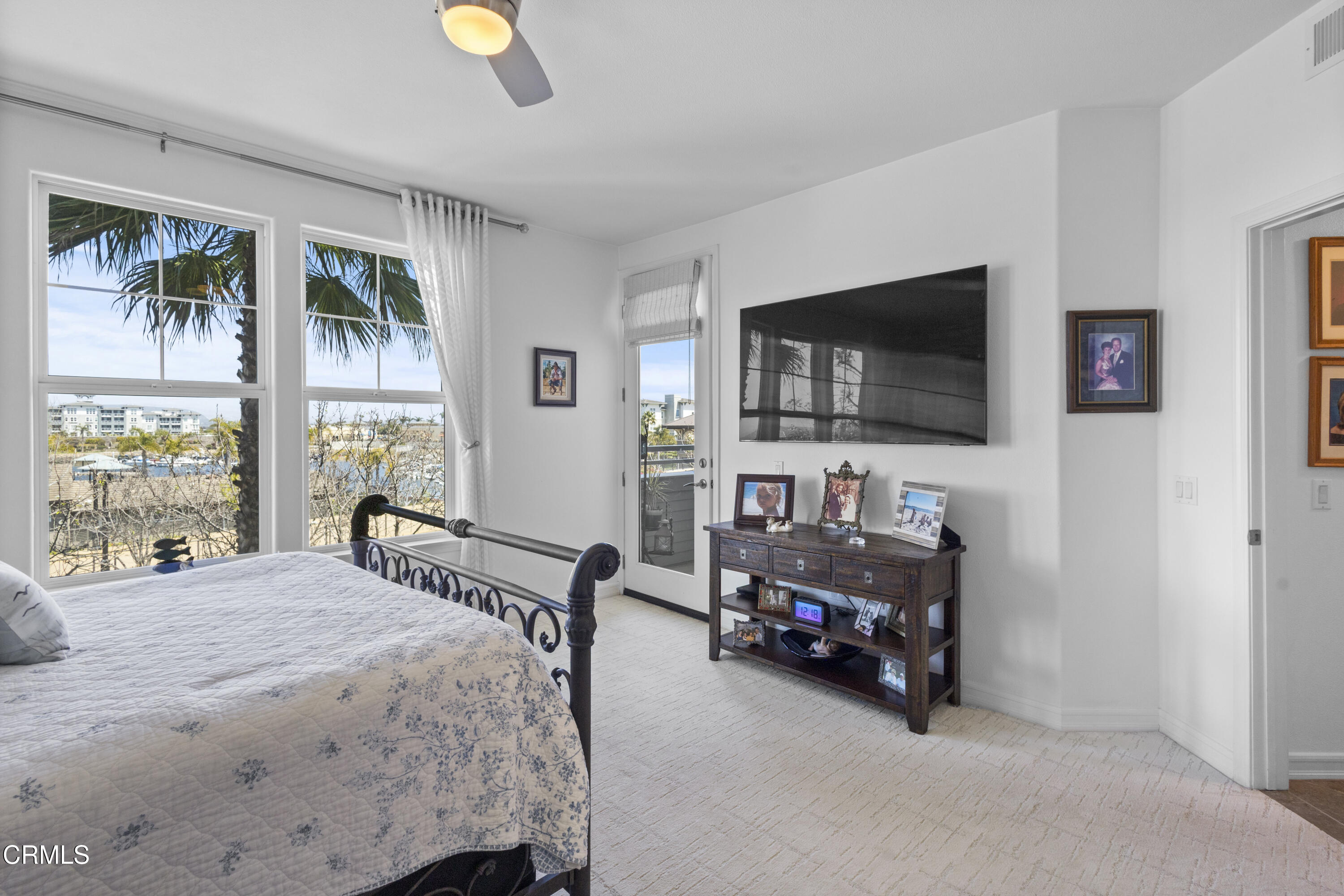 1536 Seabridge Lane Oxnard, CA 93035 - Photo 12 of 38 a bedroom with a bed and flat tv screen on the dresser