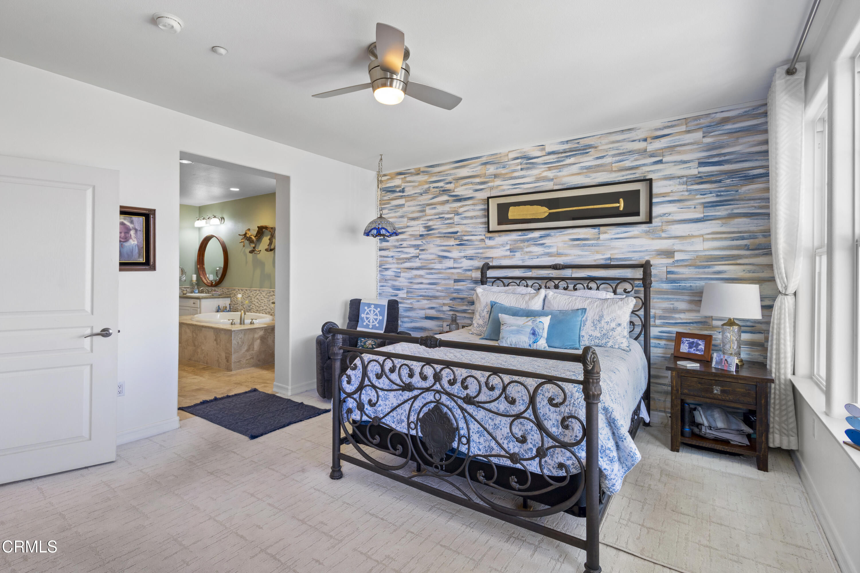 1536 Seabridge Lane Oxnard, CA 93035 - Photo 13 of 38 a bedroom with furniture and a fireplace