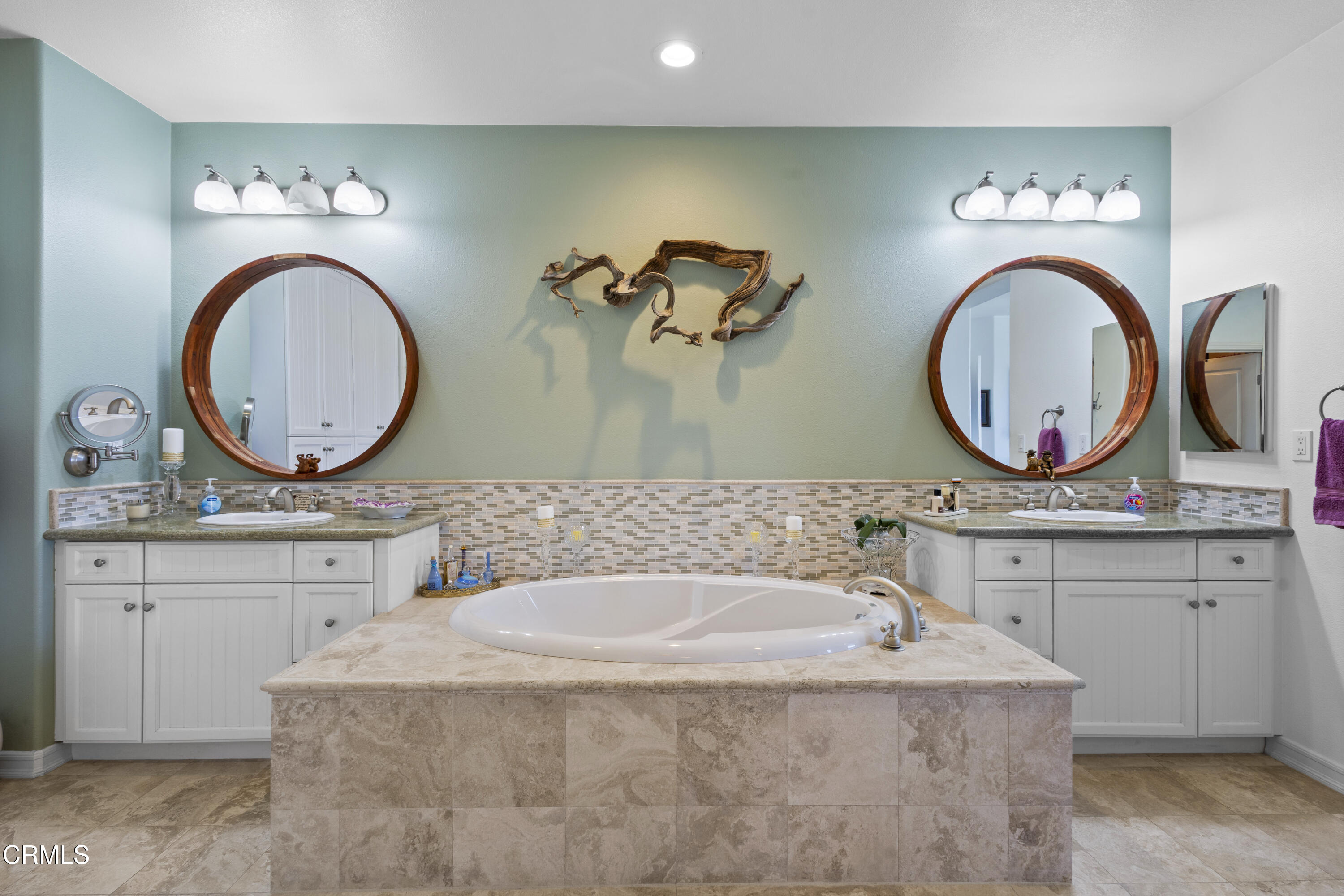 1536 Seabridge Lane Oxnard, CA 93035 - Photo 15 of 38 a bathroom with a granite countertop sink and a mirror