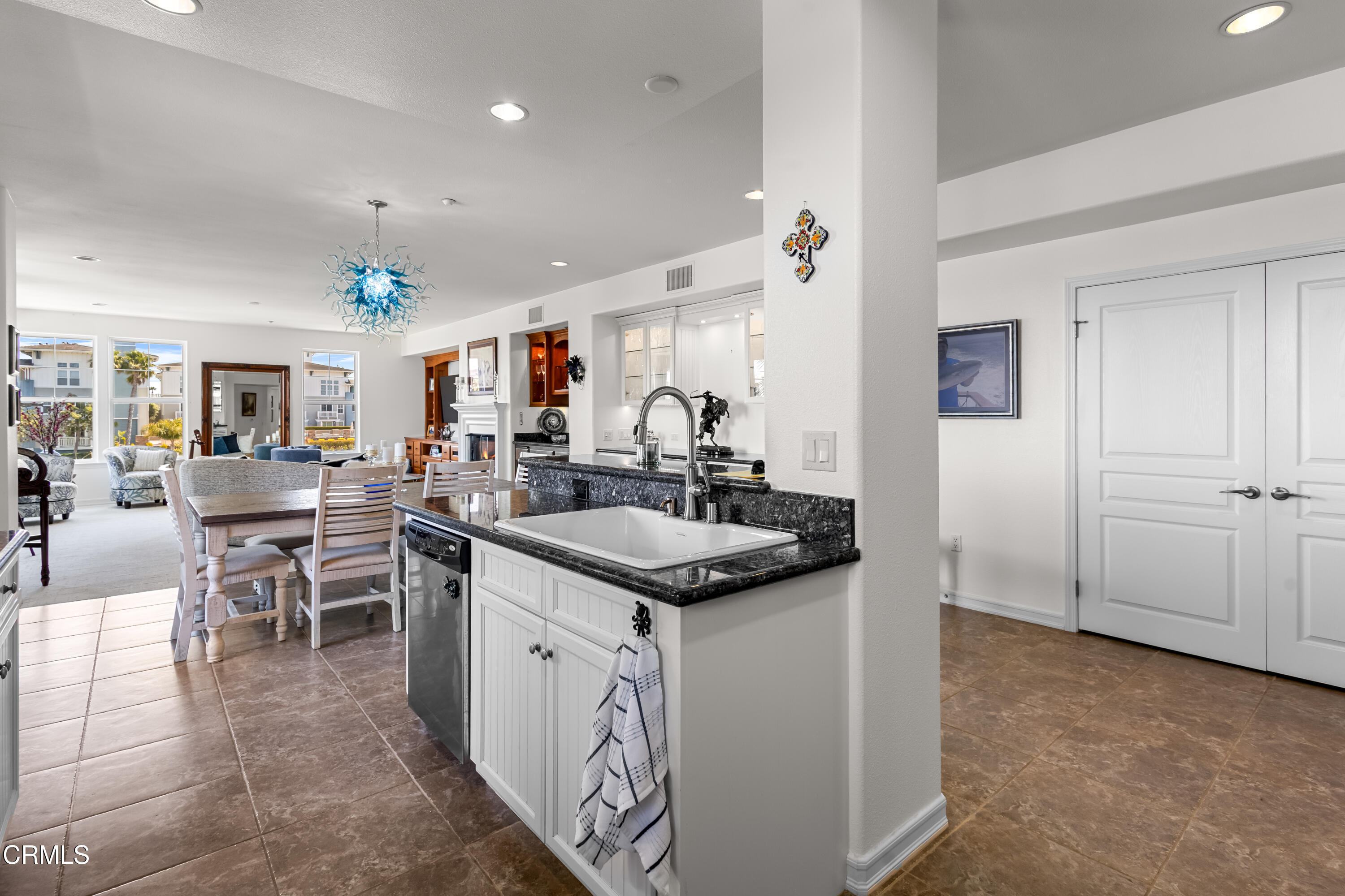 1536 Seabridge Lane Oxnard, CA 93035 - Photo 18 of 38 a kitchen with stainless steel appliances granite countertop a sink and a refrigerator