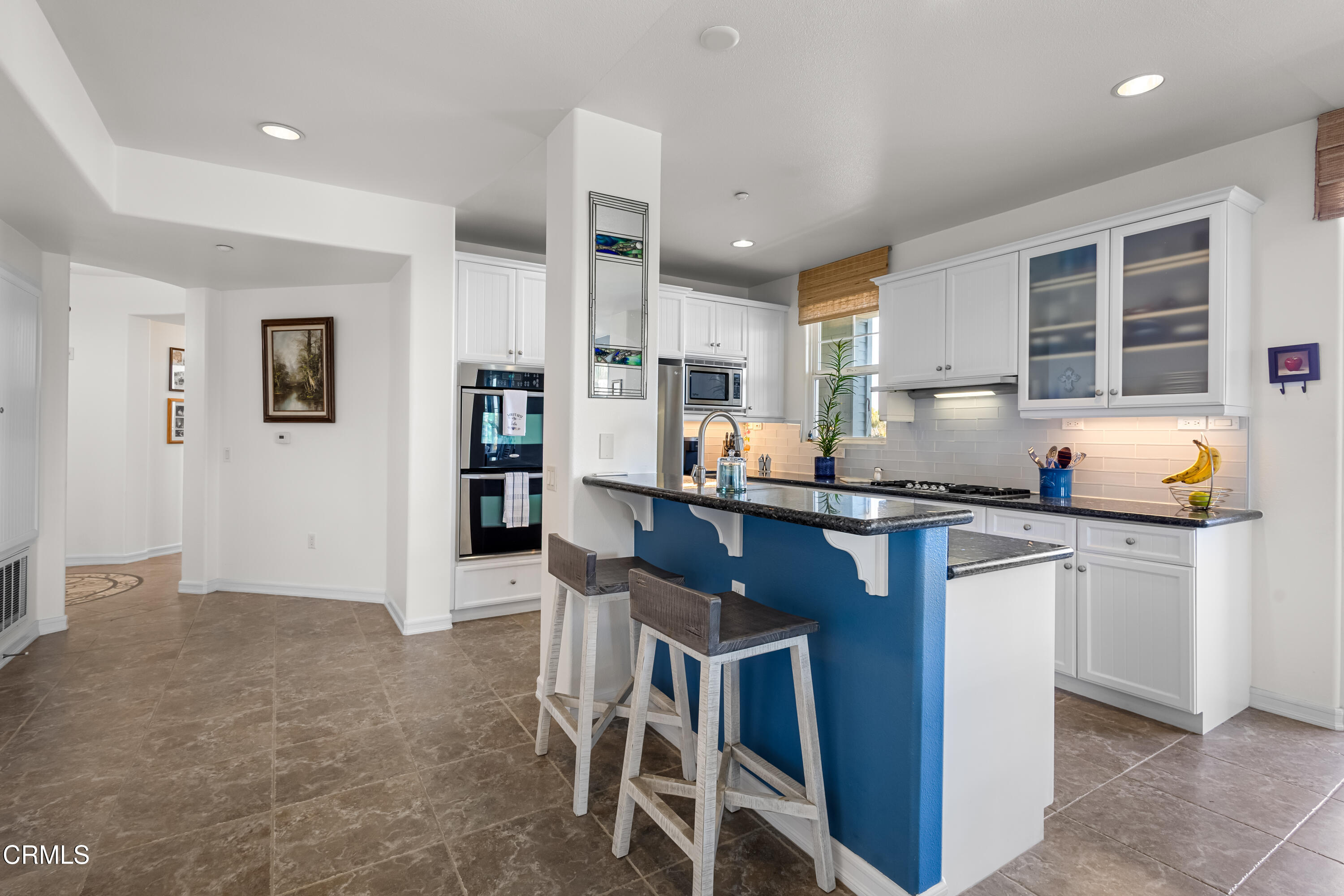 1536 Seabridge Lane Oxnard, CA 93035 - Photo 20 of 38 a kitchen with a sink cabinets and window