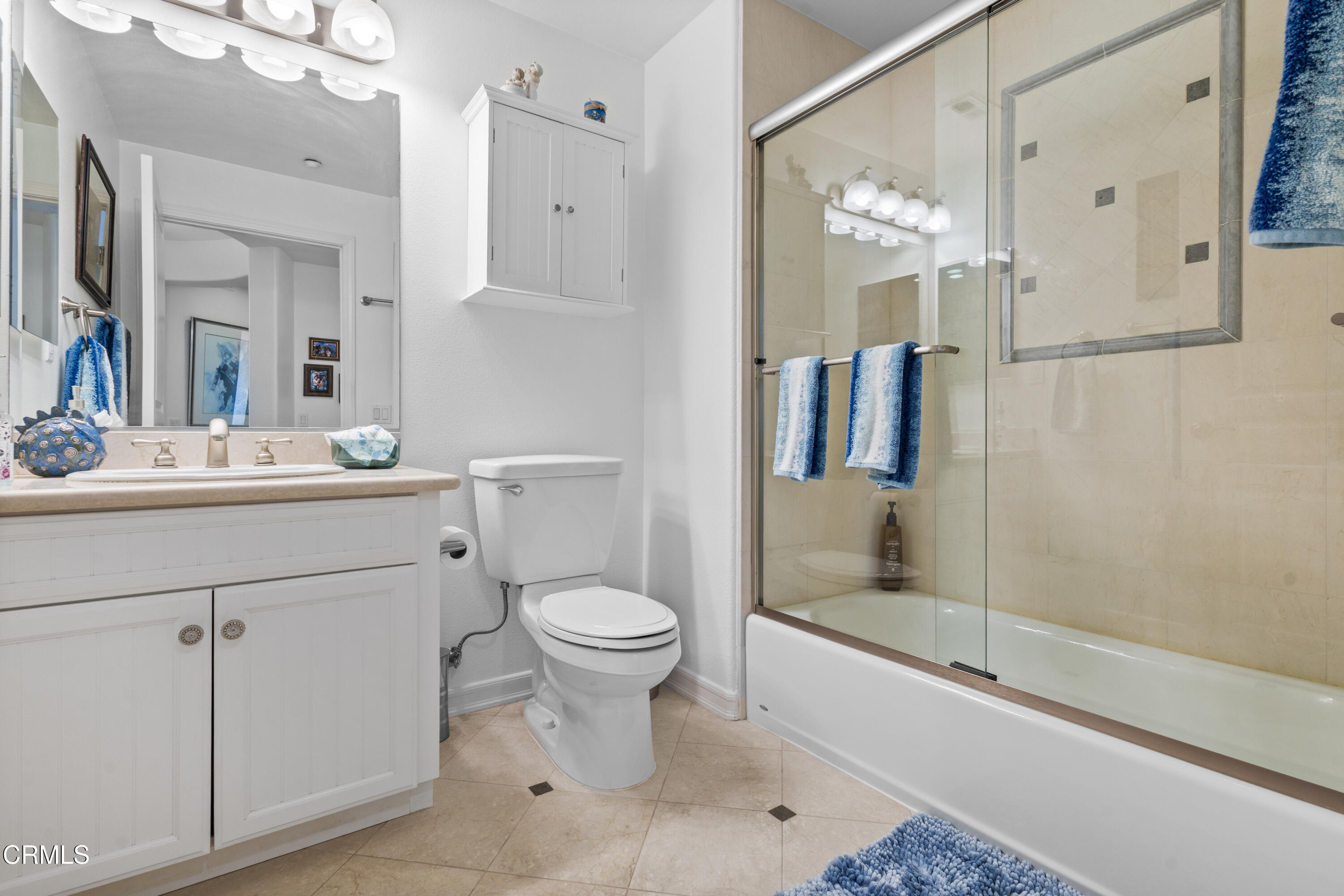1536 Seabridge Lane Oxnard, CA 93035 - Photo 6 of 38 a bathroom with a sink toilet a mirror and shower