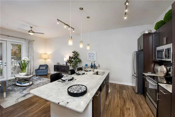 a kitchen with a table and chairs in it