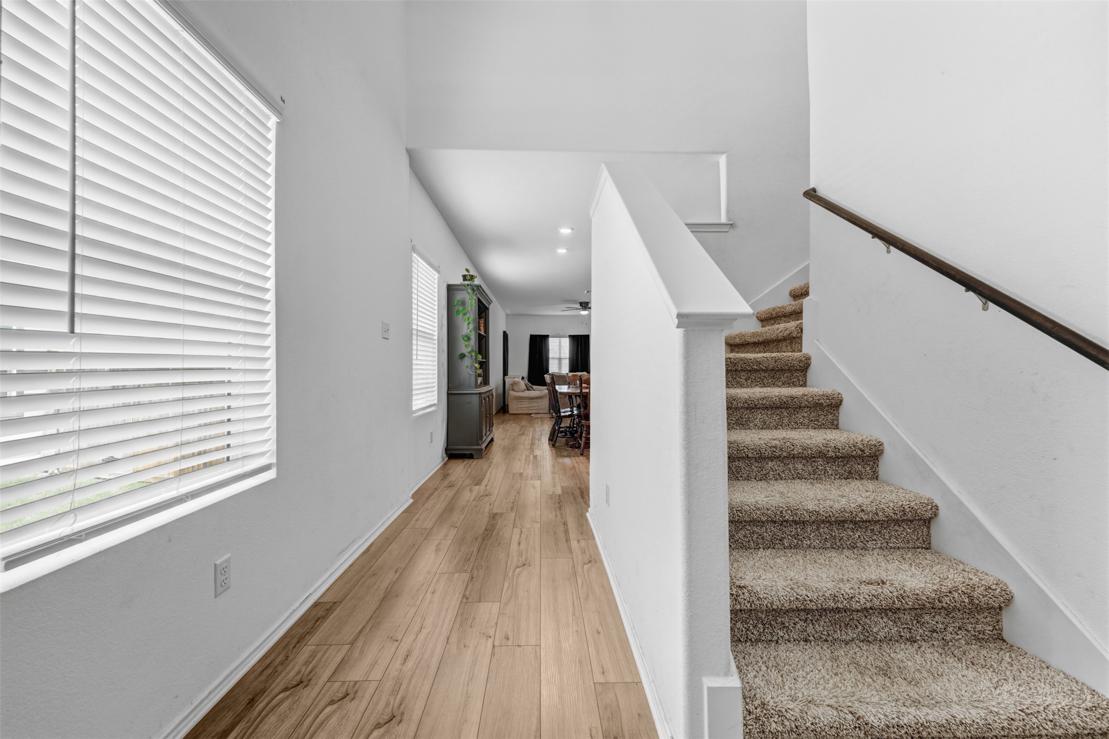 413 Perfect World Loop Jarrell, TX 76537 - Photo 7 of 39 A welcoming entryway with durable plank flooring transitions to a carpeted staircase leading to upper levels.