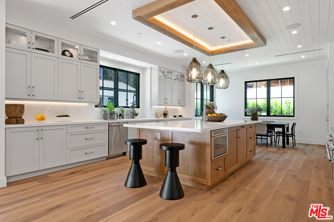 6310 Mirror Drive Los Angeles, CA 90068 - Photo 14 of 49 a kitchen with sink cabinets and wooden floor
