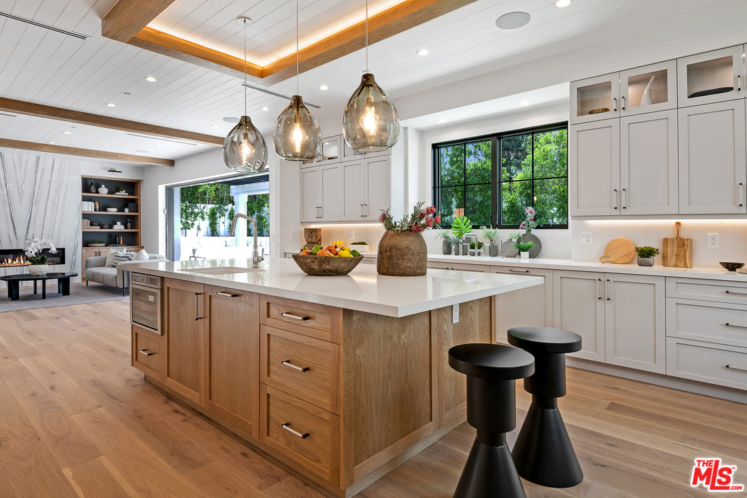 6310 Mirror Drive Los Angeles, CA 90068 - Photo 15 of 49 a kitchen with a sink cabinets and window